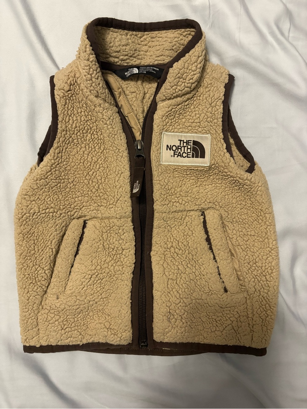 The North Face Kids Beige Sherpa Fleece Vest with Brown Trim